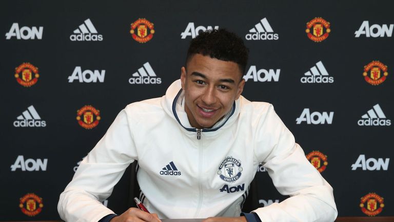 Jesse Lingard signs his new Manchester United contract at the club's Aon Training Complex