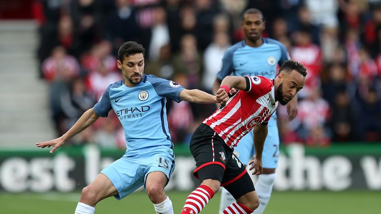 Jesus Navas and Nathan Redmond battle for the ball at St Mary's