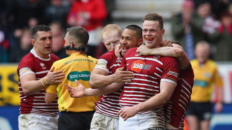 Joe Burgess celebrates with team-mates after scoring his second try against St Helens