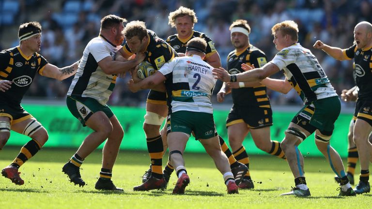 Joe Launchbury of Wasps is tackled during the Aviva Premiership match between Wasps and Northampton Saints at The Ricoh Arena