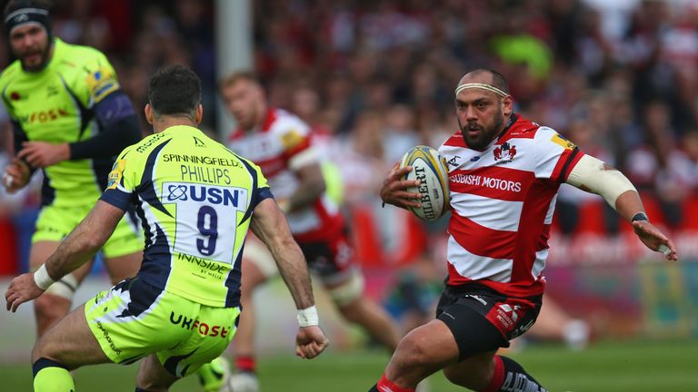 GLOUCESTER, ENGLAND - APRIL 15: John Afoa of Gloucester Rugby takes on Mike Phillips of Sale Sharks during the Aviva Premiership match between Gloucester R