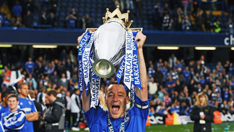 Chelsea's captain John Terry celebrates with the Barclays Premier league trophy after they win the title with a 8-0 victory over Wigan Athletic in the Engl