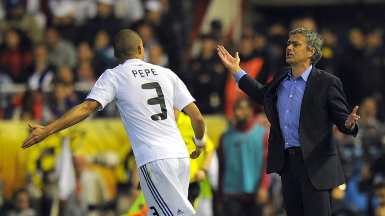 Real Madrid's Portuguese coach  Jose Mourinho (R) talks with Real Madrid's Portuguese defender Pepe (L) during the Spanish Cup final match Real Madrid agai