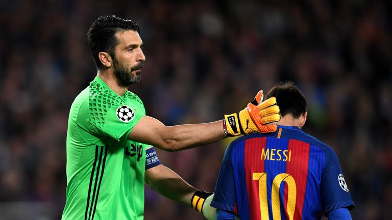 BARCELONA, SPAIN - APRIL 19:  Gianluigi Buffon ofJuventus pats Lionel Messi of Barcelona on the back during the UEFA Champions League Quarter Final second 