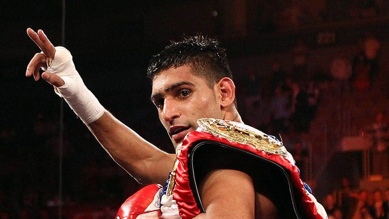 LAS VEGAS, NV - JULY 23:  Amir Khan celebrates after his fifth round knockout of Zab Judah in their super lightweight world championship unification bout a