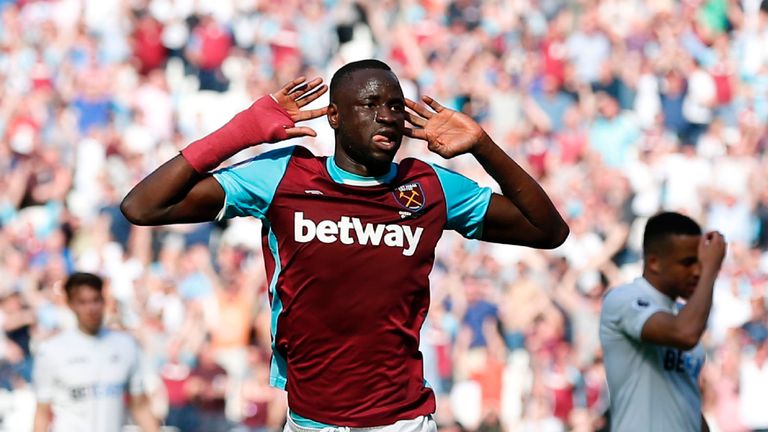 West Ham United's Senegalese midfielder Cheikhou Kouyate celebrates scoring the opening goal during the English Premier League football match between West 