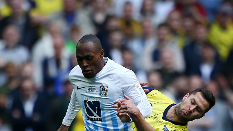 Coventry's Kyle Reid holds off Oxford's Phil Edwards during the EFL Checkatrade Trophy Final