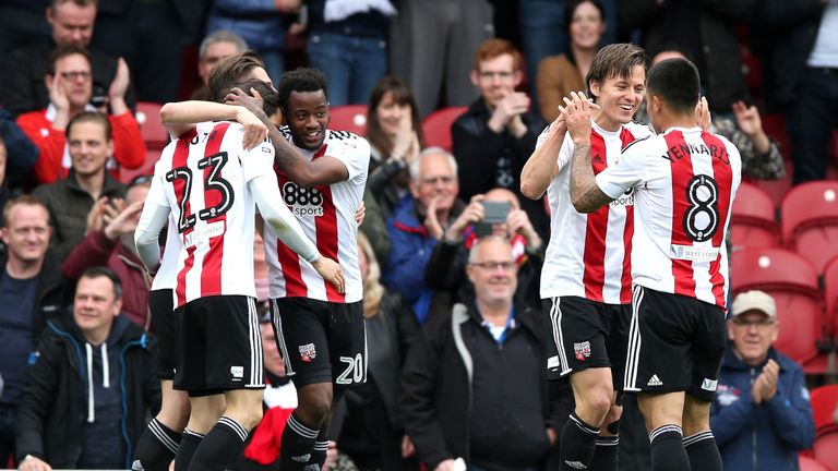 Lasse Vibe celebrates with team-mates after scoring Brentford's opening goal of the game
