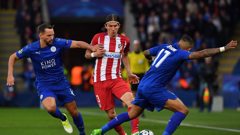 Atletico Madrid's Brazilian defender Filipe Luis (C) vies with Leicester City's English midfielder Danny Drinkwater (L) and Leicester City's English defend