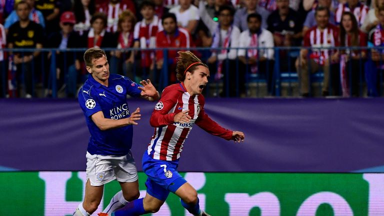 Leicester City's midfielder Marc Albrighton upends Atletico Madrid's Antoine Griezmann during the Champions League quarter-final first leg