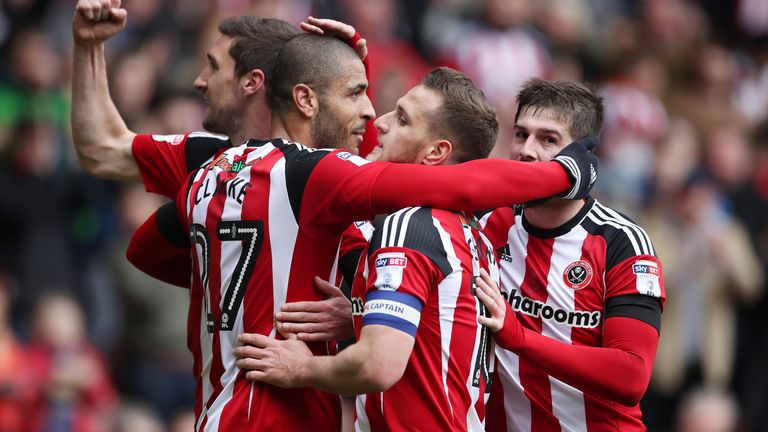 Leon Clarke celebrates his second and Sheffield United's third goal of the game with team-mates