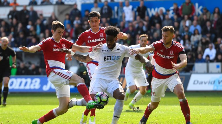 Leroy Fer shoots while under pressure from Marten de Roon and Ben Gibson