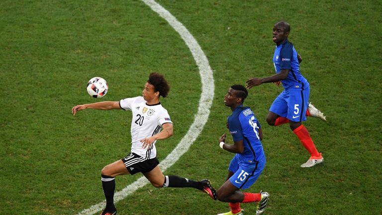 MARSEILLE, FRANCE - JULY 07:  Leroy Sane of Germany controls the ball under pressure from Paul Pogba and N'Golo Kante of France during the UEFA EURO semi f