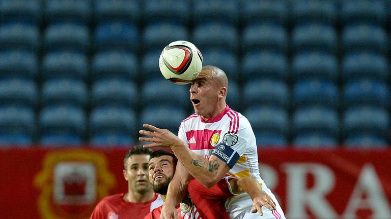 Scotland's Scott Brown battles for the ball with Gibraltar's Liam Walker, during the European Championship Qualifying match at the Estadio Algarve, Faro, P