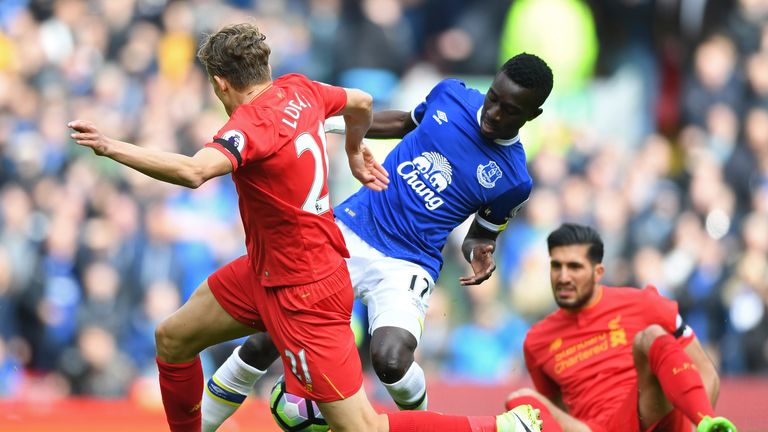 LIVERPOOL, ENGLAND - APRIL 01: Lucas Leiva of Liverpool (L) and Idrissa Gueye of Everton (R) battle for possession during the Premier League match between 