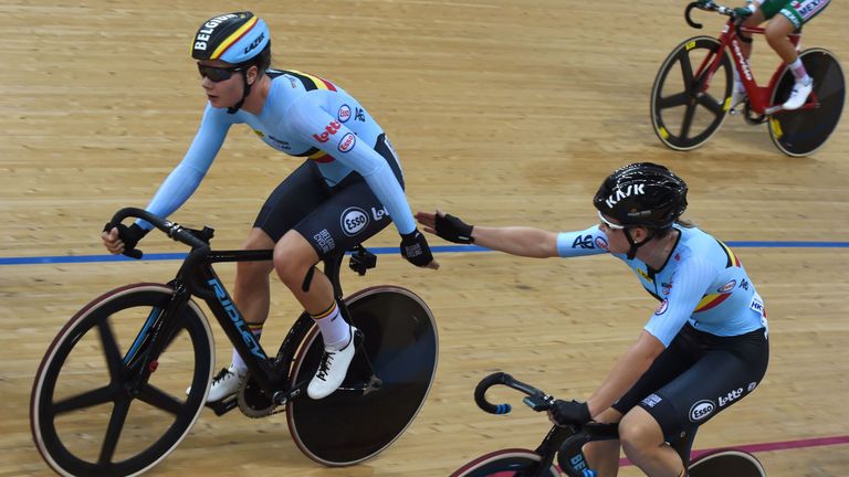 Belgium's Lotte Kopecky (L) and Jolien D'Hoore sling each other during the women's madison final at the Hong Kong Velodrome during the Track Cycling World 