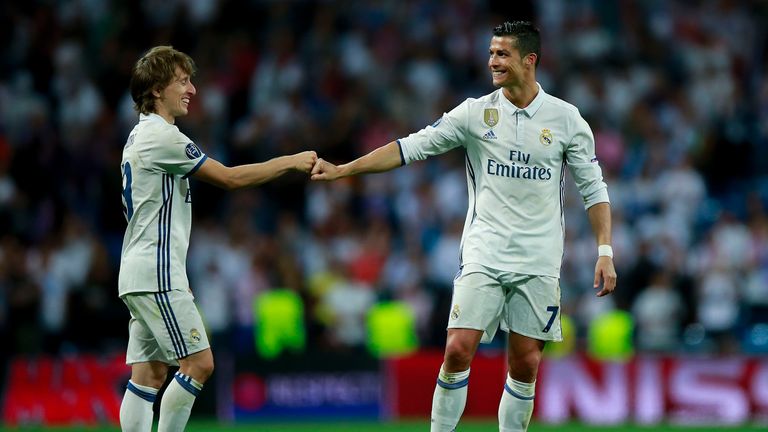 MADRID, SPAIN - APRIL 18: Cristiano Ronaldo (R) of Real Madrid CF clashes knuckles with his teammate Luka Modric (L) after the UEFA Champions League Quarte