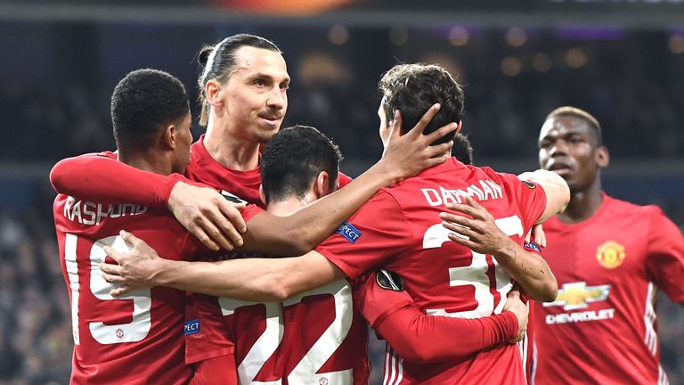 Manchester United's Henrikh Mkhitaryan (3L) celebrates with team-mates after scoring