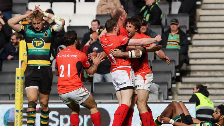 MILTON KEYNES, ENGLAND - APRIL 16:  Marcelo Bosch of Saracens is mobbed by team mates after scoring the last minute try during the Aviva Premiership match 
