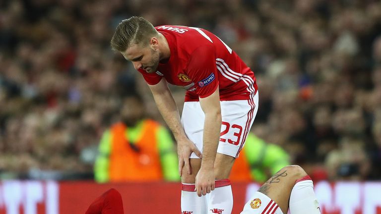 MANCHESTER, ENGLAND - APRIL 20:  Luke Shaw (23) stands over injured team mate Marcos Rojo of Manchester United during the UEFA Europa League quarter final 