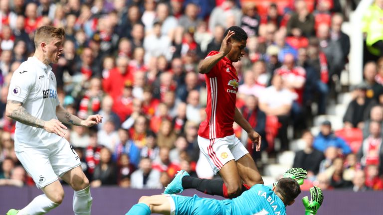 MANCHESTER, ENGLAND - APRIL 30:  Marcus Rashford of Manchester United is fouled by Lukasz Fabianski of Swansea City and a penalty is awarded to Manchester 