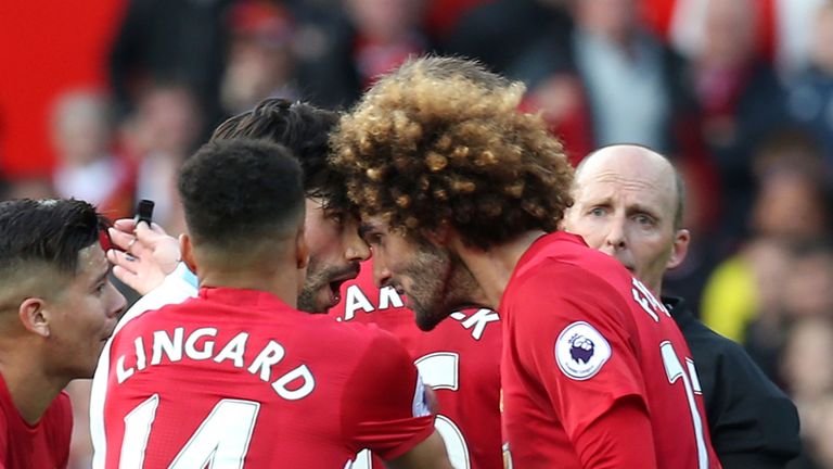 Marouane Fellaini and Claudio Yacob go head-to-head