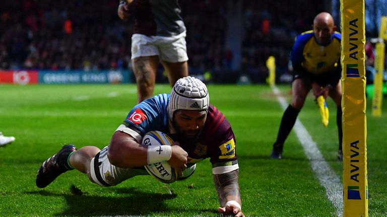 LONDON, ENGLAND - APRIL 14:  Mat Luamanu of Harlequins dives over to score his side's first try during the Aviva Premiership match between Harlequins and E