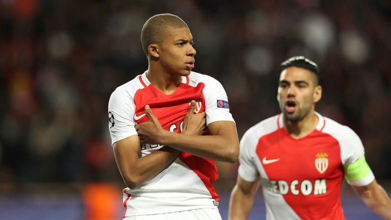 Monaco's French forward Kylian Mbappe Lottin  (L) celebrates after scoring a goal during the UEFA Champions League 2nd leg quarter-final football match AS 