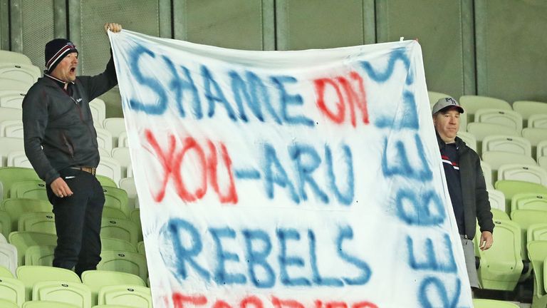 Rebels supporters in the crowd make their feelings known
