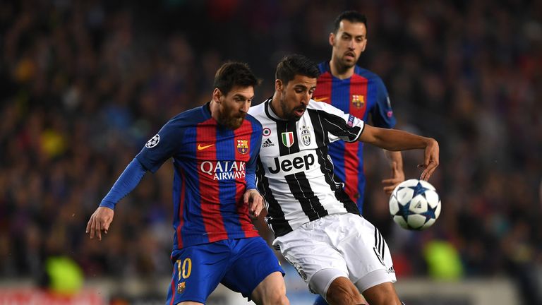 BARCELONA, SPAIN - APRIL 19: Lionel Messi of Barcelona and Sami Khedira of Juventus battle for possession during the UEFA Champions League Quarter Final se