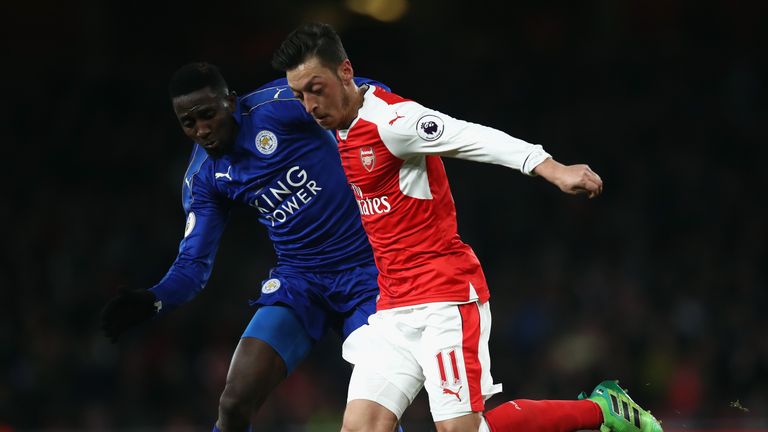 Mesut Ozil and Wilfred Ndidi tussle during Leicester's visit to the Emirates