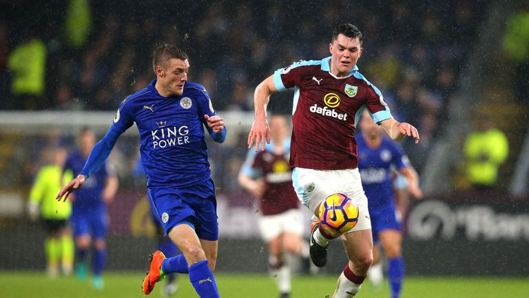 Michael Keane is pressured by Jamie Vardy during the Premier League match between Burnley and Leicester
