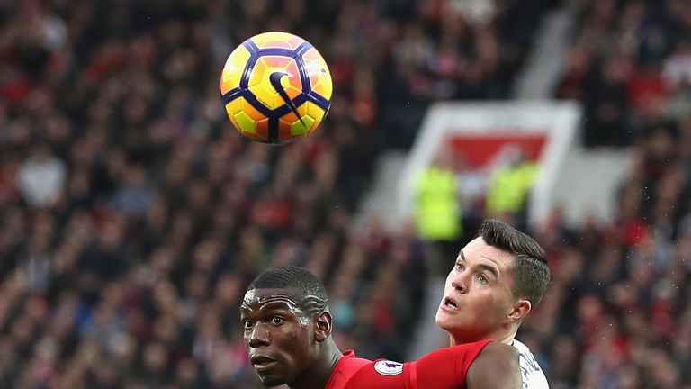 Paul Pogba of Manchester United (L) and Michael Keane of Burnley (R) battle for possession