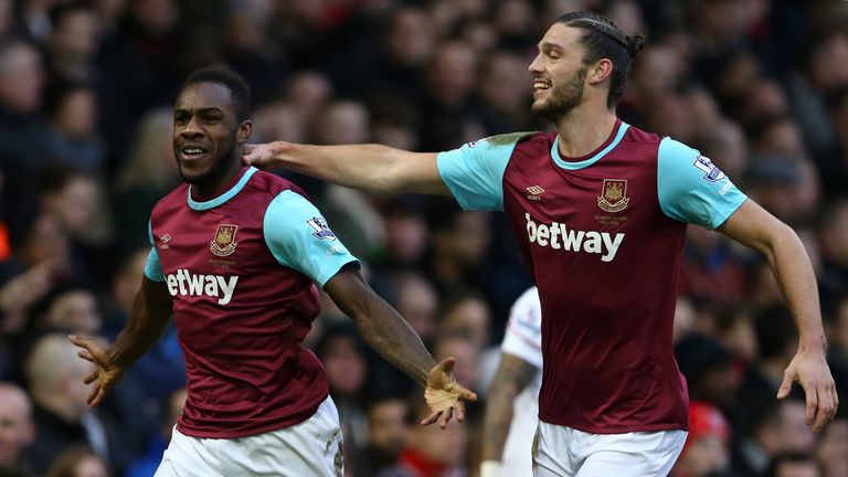 West Ham United's English midfielder Michail Antonio celebrates with West Ham United's English striker Andy Carroll (R) after scoring the opening goal of t