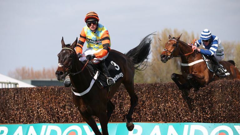 Nico De Boinville has a look at the big screen to see where Whisper is as they land over the second-last fence.