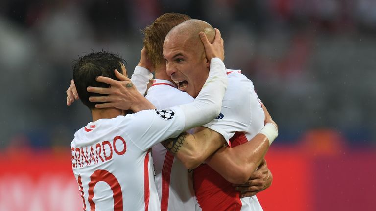 Monaco's players celebrate following Sven Bender's own goal