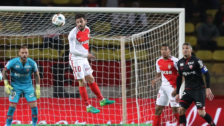 Monaco's Portuguese midfielder Bernardo Silva (C) goes for a header during the French L1 football match Monaco (ASM) vs Dijon (DFCO) on April 15, 2017 at t