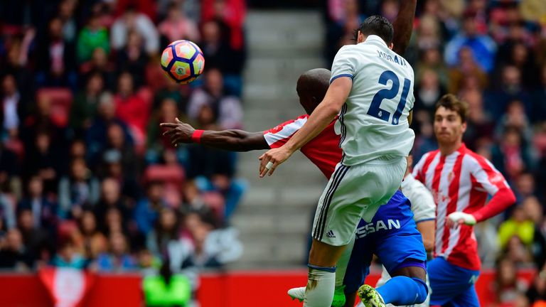 Alvaro Morata heads the ball to score 