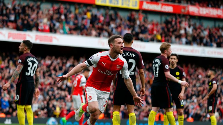 Arsenal's German defender Shkodran Mustafi celebrates after scoring their second goal during the English Premier League football match between Arsenal and 