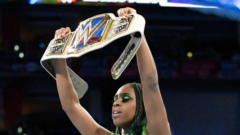 Naomi stands tall after confronting Charlotte Flair in the ring.