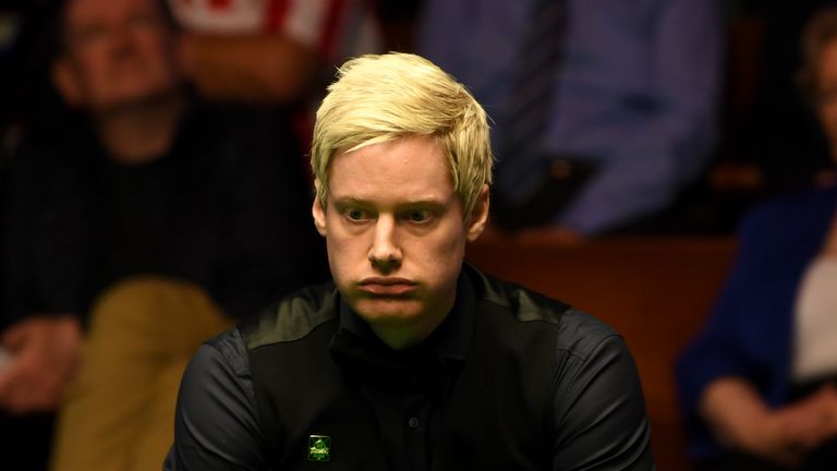 Neil Robertson lines up a shot against Noppon Saengkham during their first round match of the 2017 World Snooker Championship in Sheffield