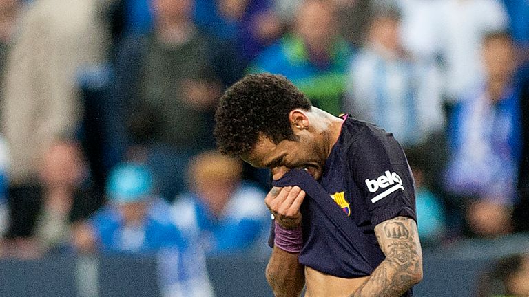 Neymar Jr. leaves the pitch after recieving a red card during the La Liga match against Malaga