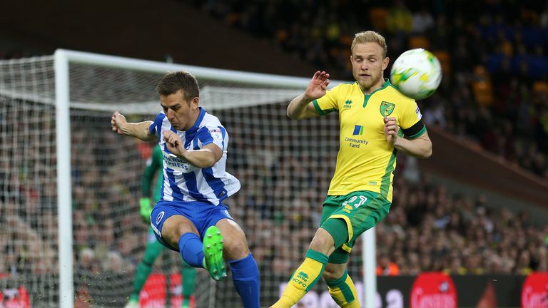 Brighton & Hove Albion's Uwe Hunemeier (left) and Norwich City's Alex Pritchard in action during the Sky Bet Championship match at Carrow Road, Norwich.