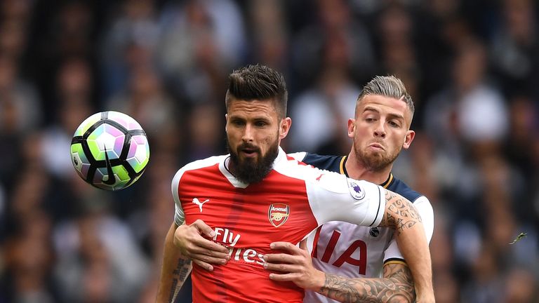 Olivier Giroud of Arsenal and Toby Alderweireld of Tottenham Hotspur compete for the ball during the Premier League match