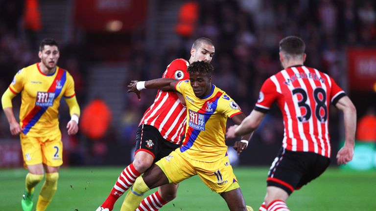 Oriol Romeu and Wilfried Zaha battle for possession at St Mary's