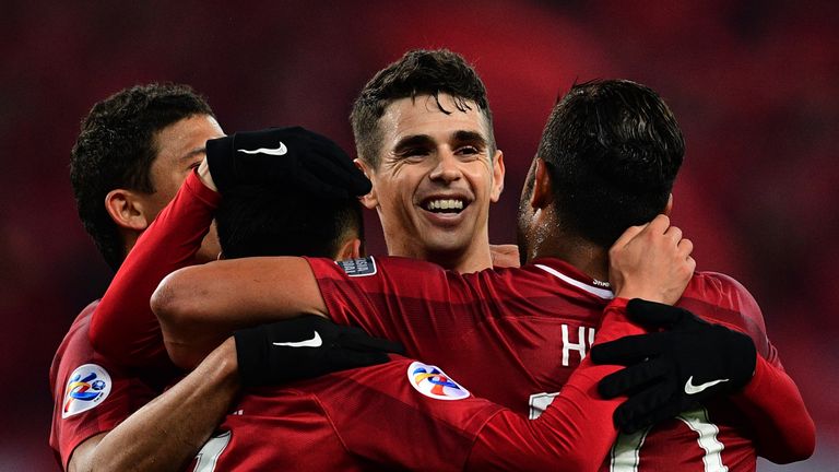 Shanghai SIPG's Brazilian midfielder Oscar celebrates with his teammates during an AFC Asian Champions League group football match