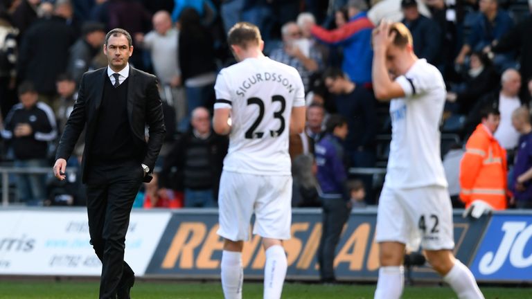 SWANSEA, WALES - APRIL 02:  Paul Clement, Manager of Swansea City walks onto the pitch to speak to his players after the Premier League match between Swans