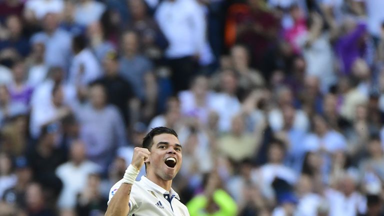 Real Madrid's Portuguese defender Pepe celebrates scoring a goal during the Spanish league football match Real Madrid CF vs Club Atletico de Madrid at the 