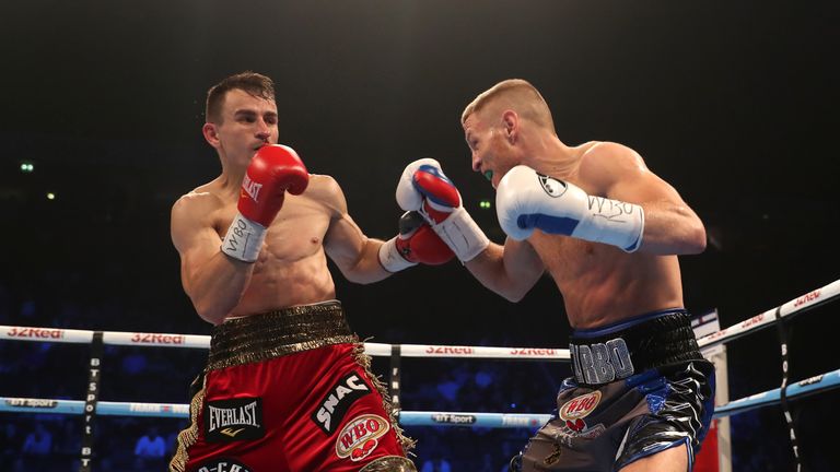 Terry Flanagan (R) and Petr Petrov in action in their WBO lightweight title fight in Manchester