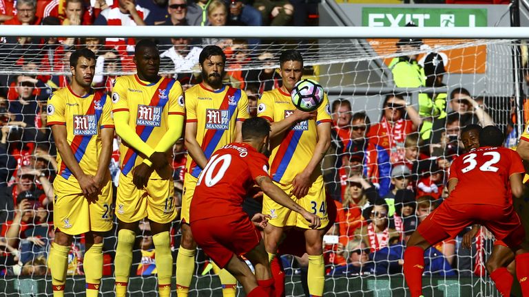 Liverpool's Brazilian midfielder Philippe Coutinho (C) scores during the English Premier League football match between Liverpool and Crystal Palace at Anfi